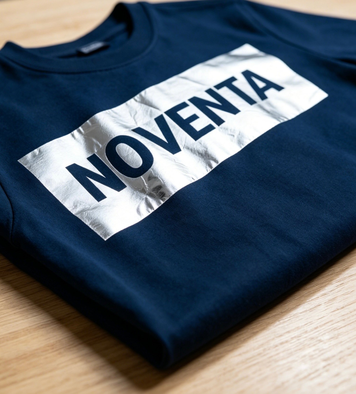 Hot-stamped silver print finish on custom apparel
