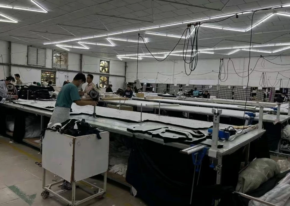 Fabric cutting and preparation area with garment material laid out for production