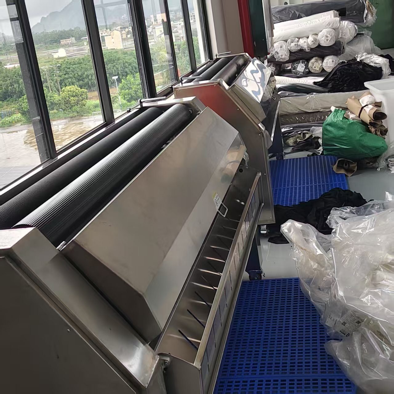 Fabric and material inspection at China clothing manufacturer incoming QC
