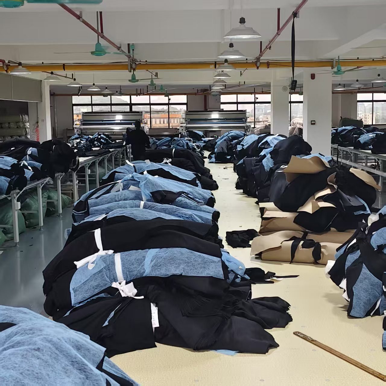 Final garment inspection and packing before shipment from clothing manufacturer China