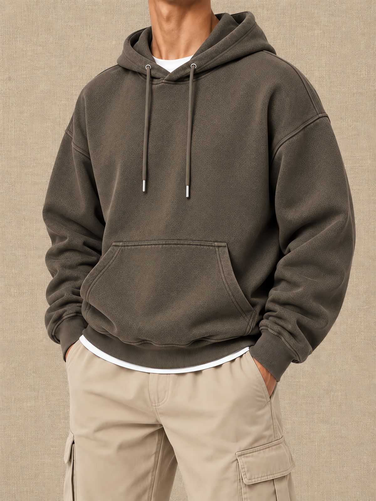 Olive pullover hoodie with drawcords and a front pouch, shown on a model