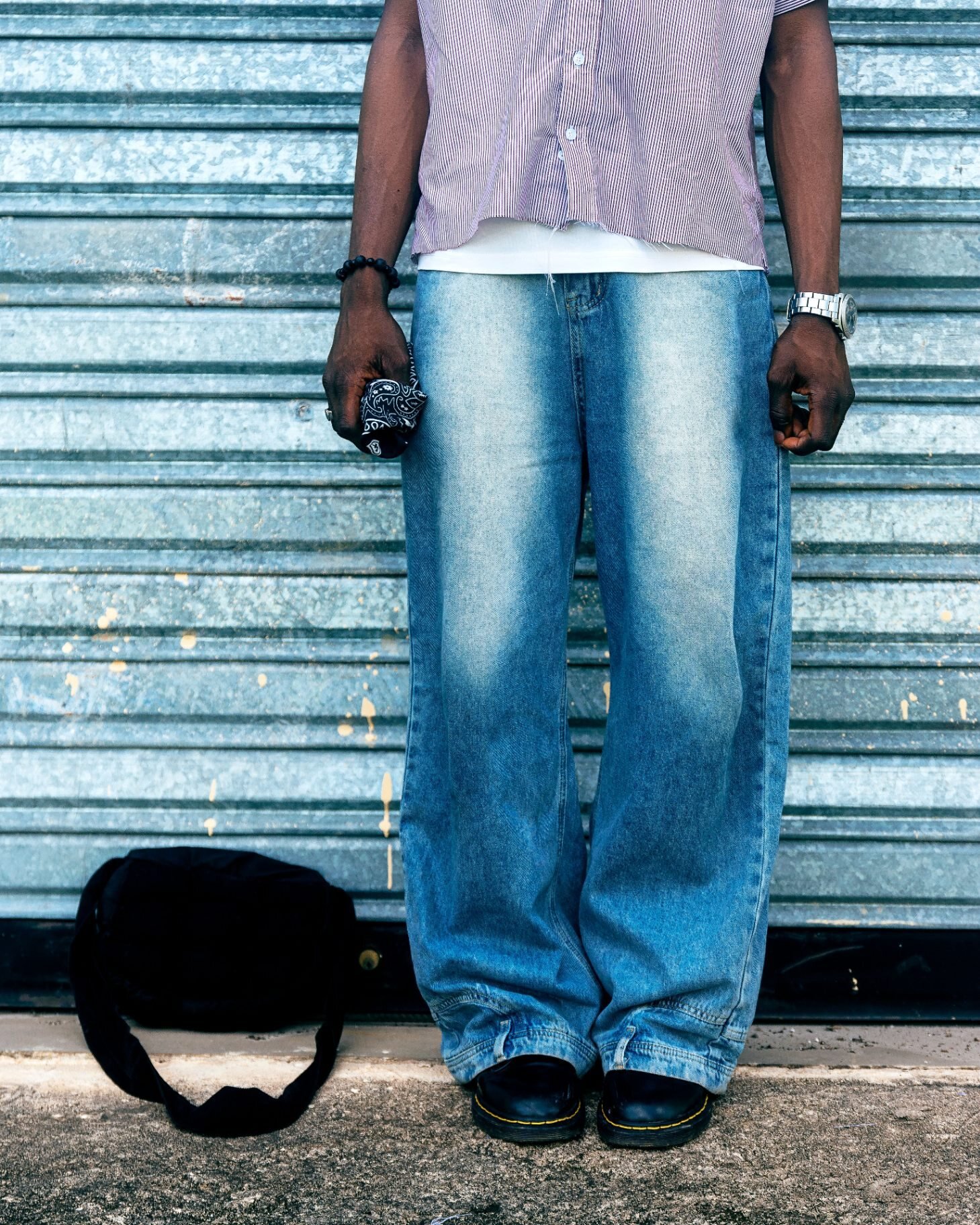 Wide-leg light wash jeans, full-length street style photo