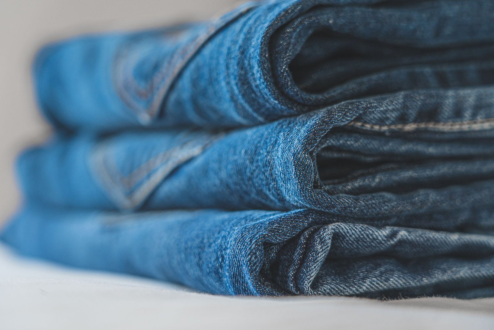 Stack of folded denim jeans from a denim manufacturer in China