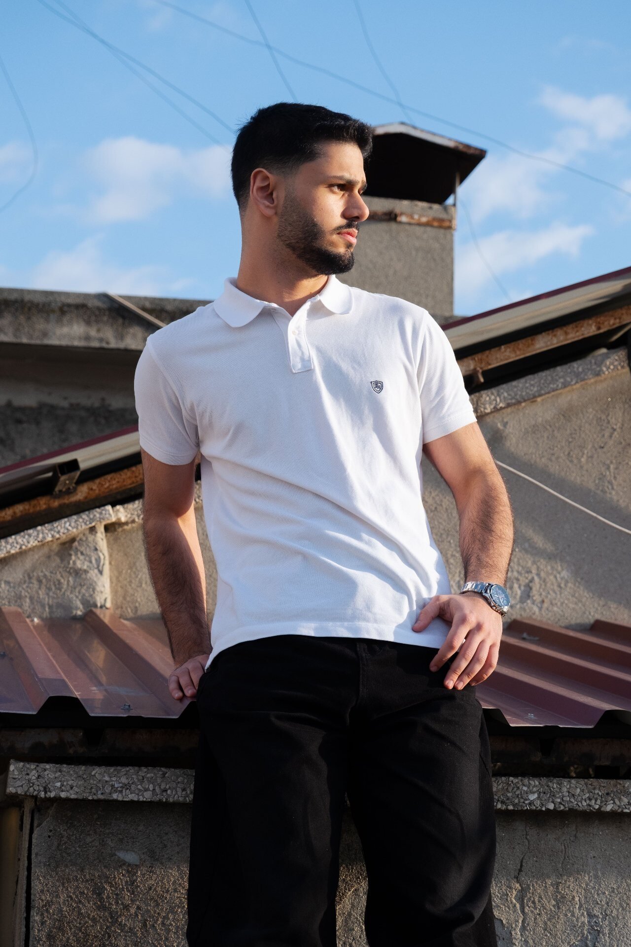 Men's white pique polo shirt with chest badge, custom polo shirt manufacturing sample
